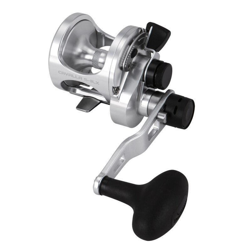 OKUMA Cavalla Lever Drag 5IILX LH fishing reel with a sleek silver finish, ergonomic handle, and durable construction for left-handed anglers.